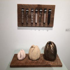 Alchemy Award winning sculpture showing ceramic process with mounted test tubes and sculpted forms on aged wood panels