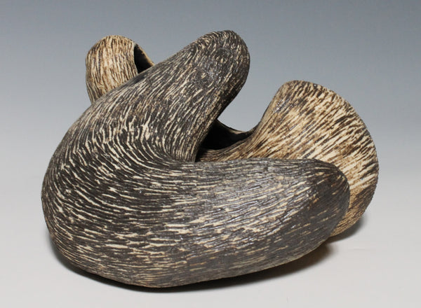 Two interrelated organic forms reminiscent of otters nestled together in a hug. Both can be used as vessels and alternate formations can be arranged by home owner. 