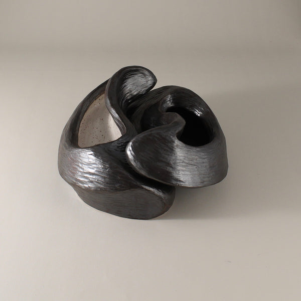 Pewter glazed ceramic sculpture with two nestled organic forms with openings